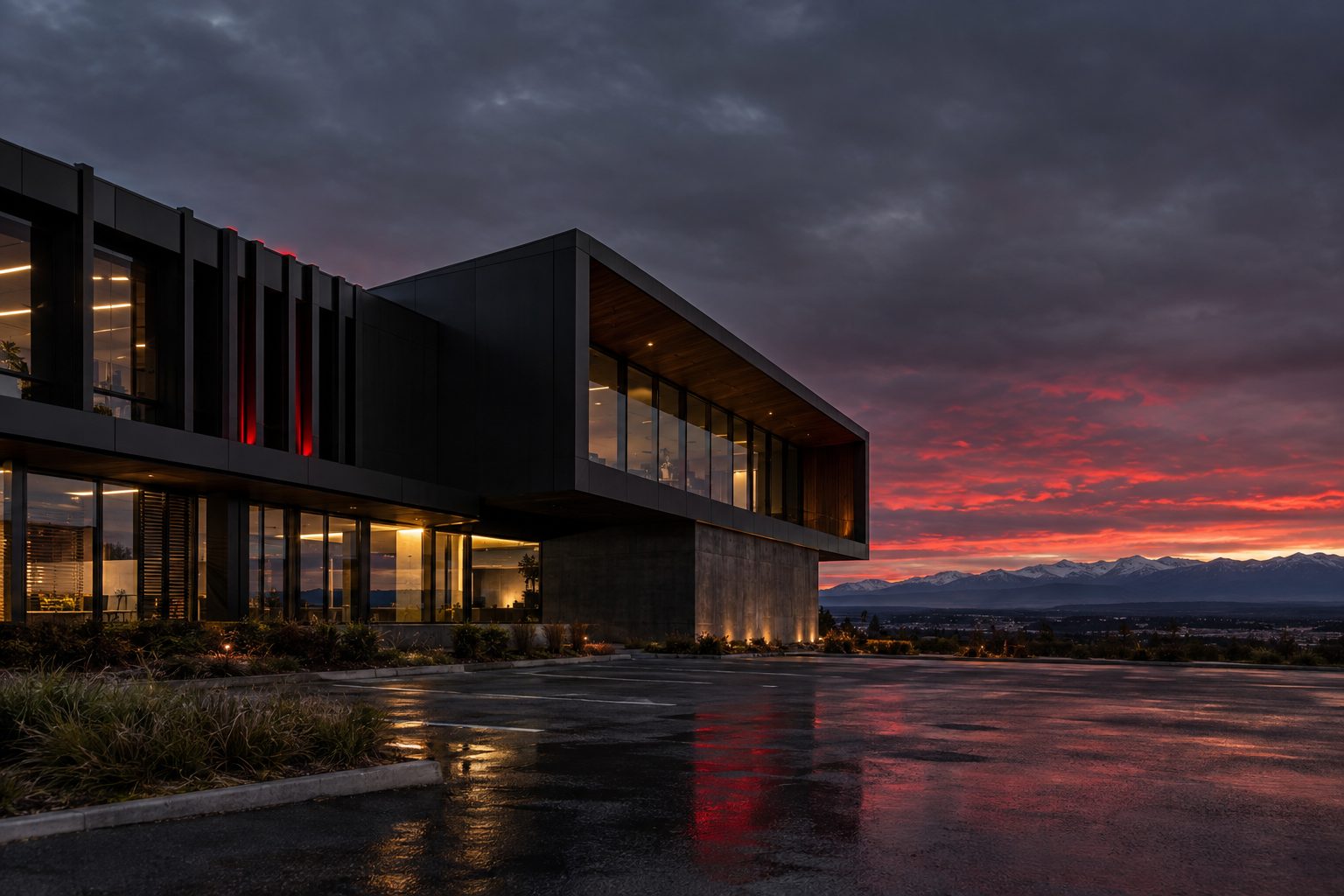 Modern dark-clad commercial building in Canterbury at dusk